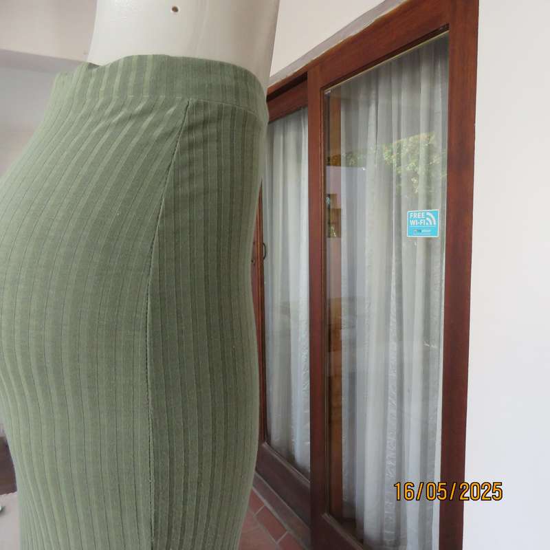 IQ olive green ribbed polyester bodycon low calf length skirt. Size 34