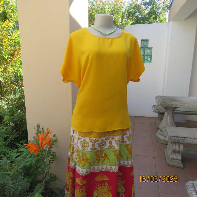 Butterscotch yellow polyester slip over size 38 top. Tiny cut-on sleeves.