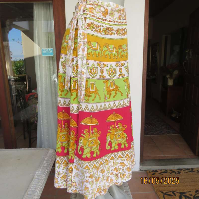 Wrap around 100% cotton size 44-44 skirt in horizontal elephant-floral patterns.