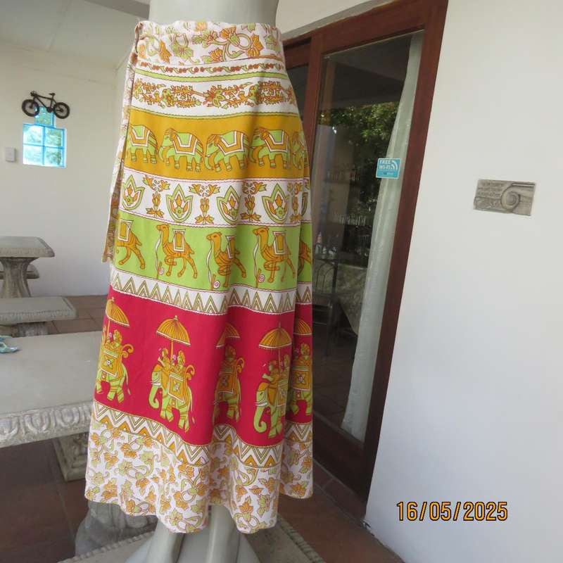 Wrap around 100% cotton size 44-44 skirt in horizontal elephant-floral patterns.