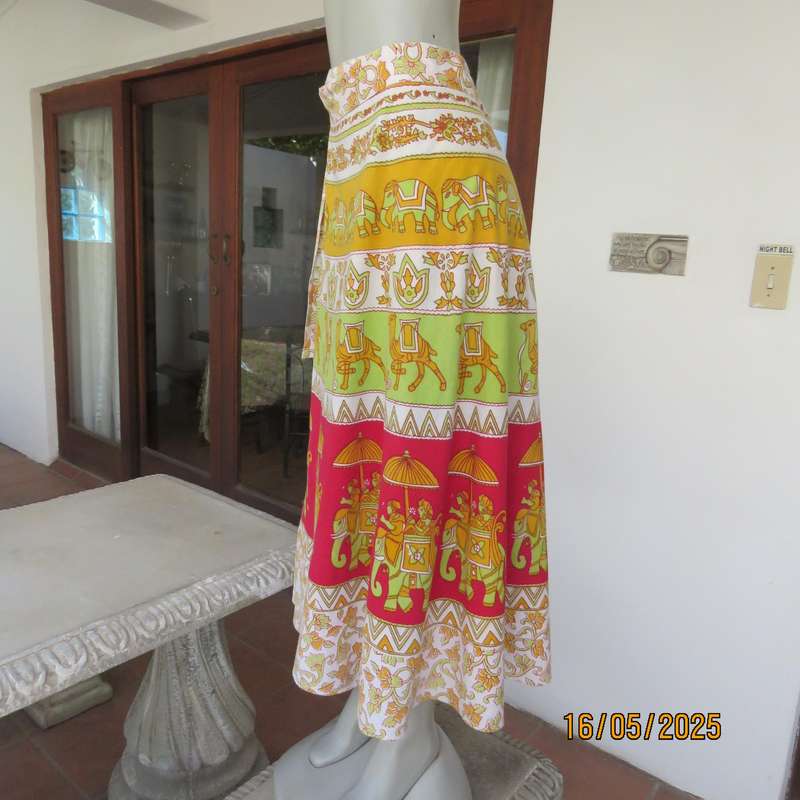 Wrap around 100% cotton size 44-44 skirt in horizontal elephant-floral patterns.