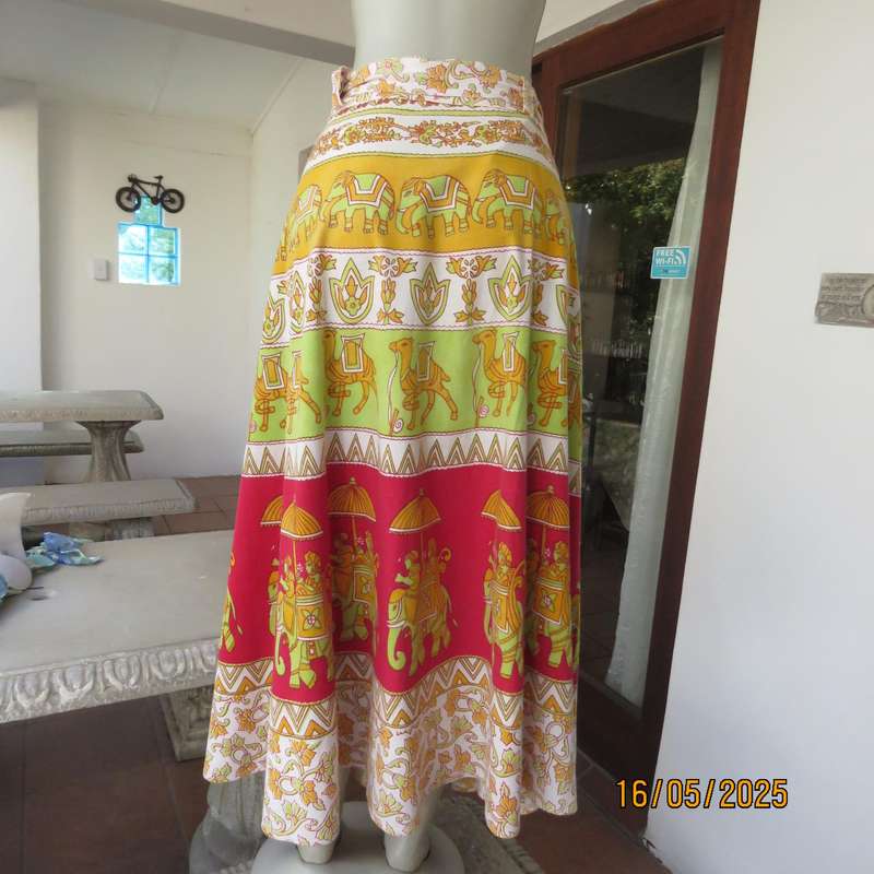 Wrap around 100% cotton size 44-44 skirt in horizontal elephant-floral patterns.