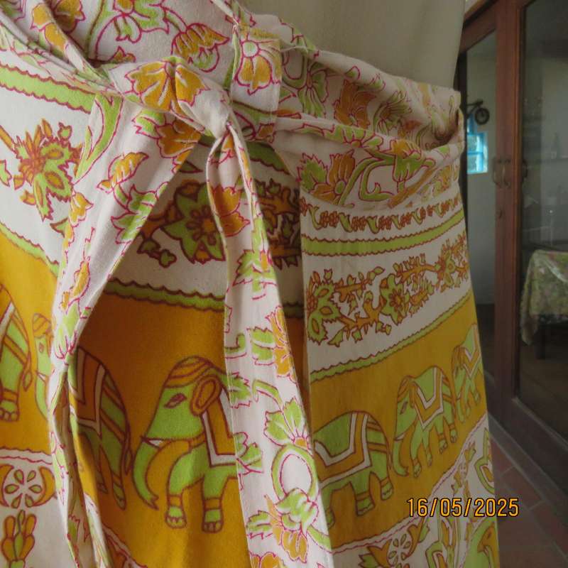 Wrap around 100% cotton size 44-44 skirt in horizontal elephant-floral patterns.