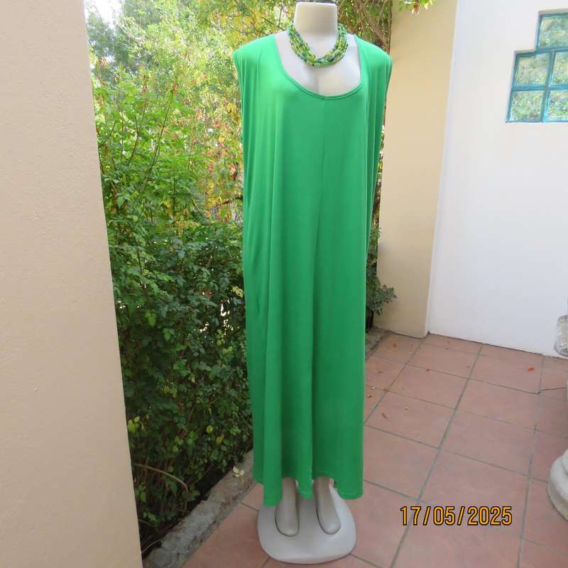 Shamrock green slip over size 46-48 shift dress. Slit on front. Polyester stretch