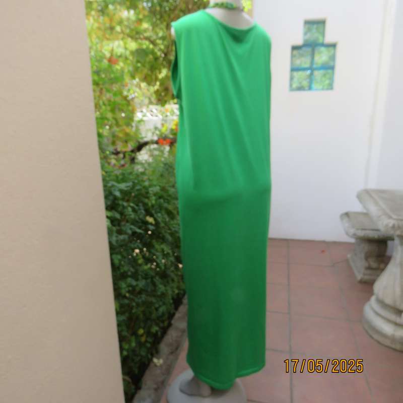 Shamrock green slip over size 46-48 shift dress. Slit on front. Polyester stretch