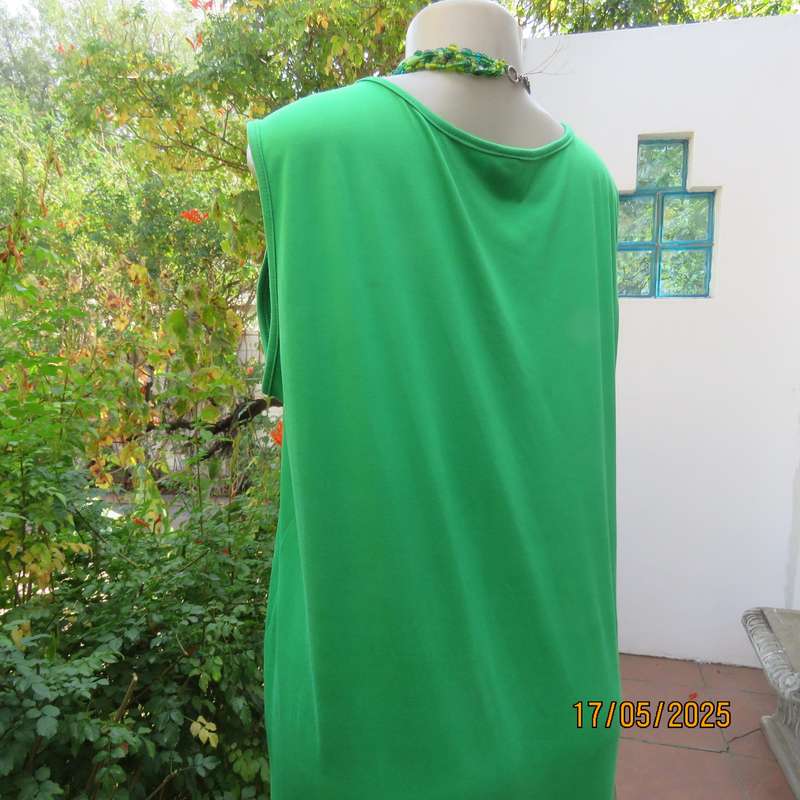 Shamrock green slip over size 46-48 shift dress. Slit on front. Polyester stretch