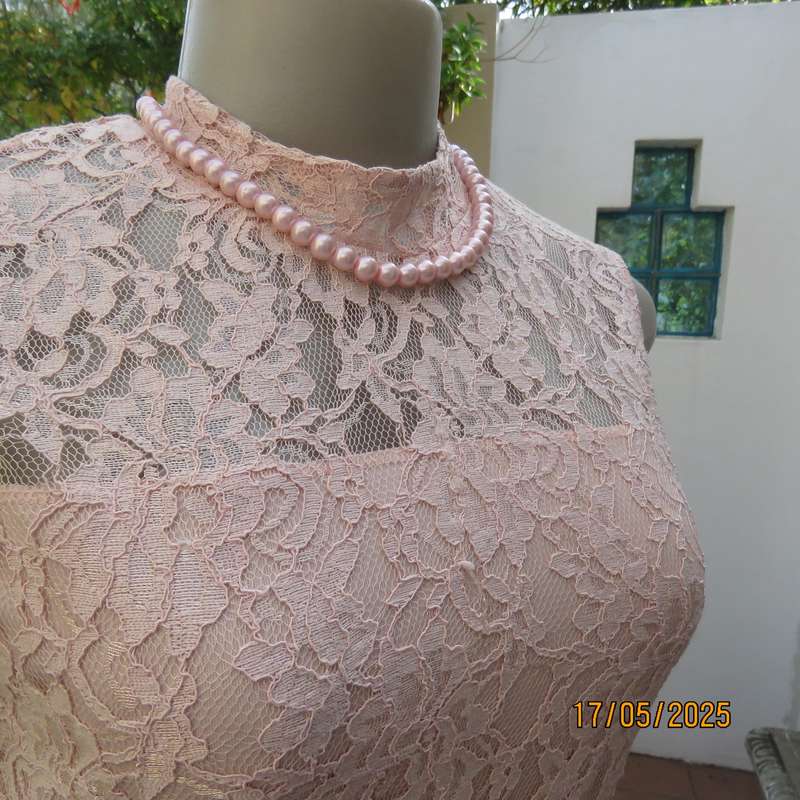 RT pale peach polyester lace mini dress with stretch poly lining. Size 32. Pleated bottom