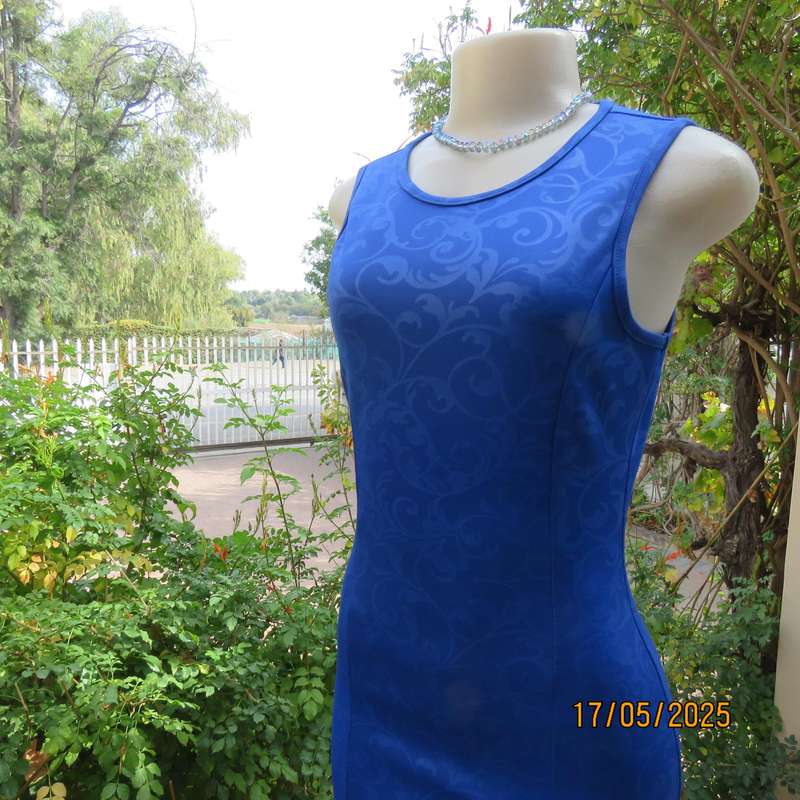 Royal blue bodycon stretch heavy embossed polyester dress. Size 32. Zip at back.