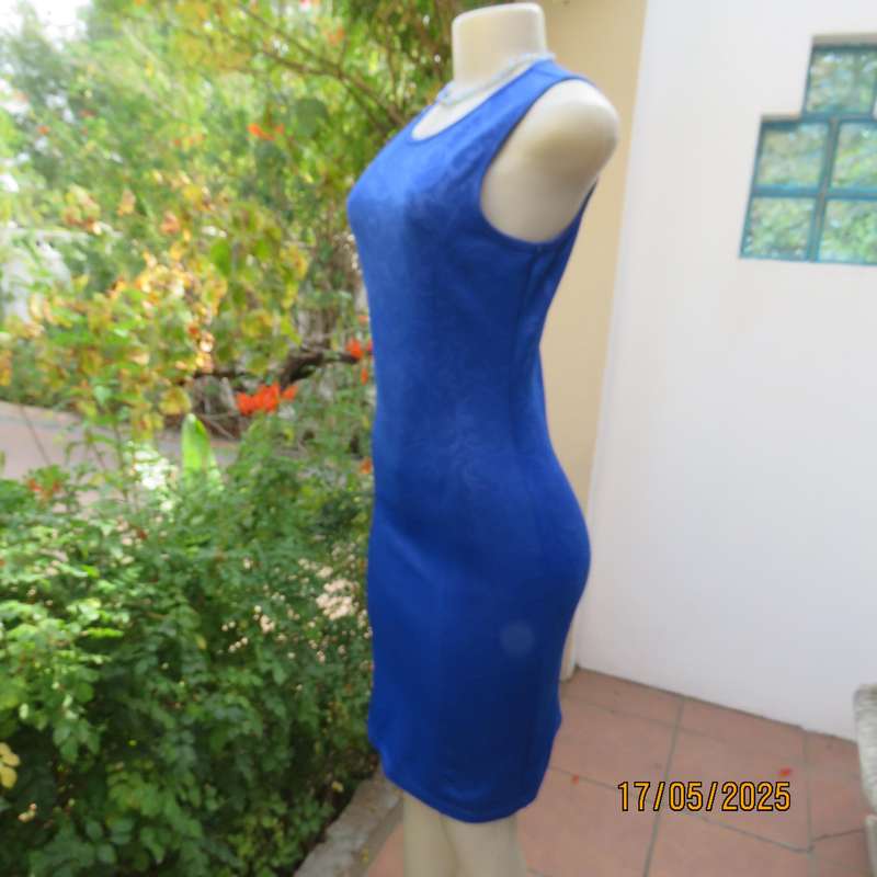 Royal blue bodycon stretch heavy embossed polyester dress. Size 32. Zip at back.