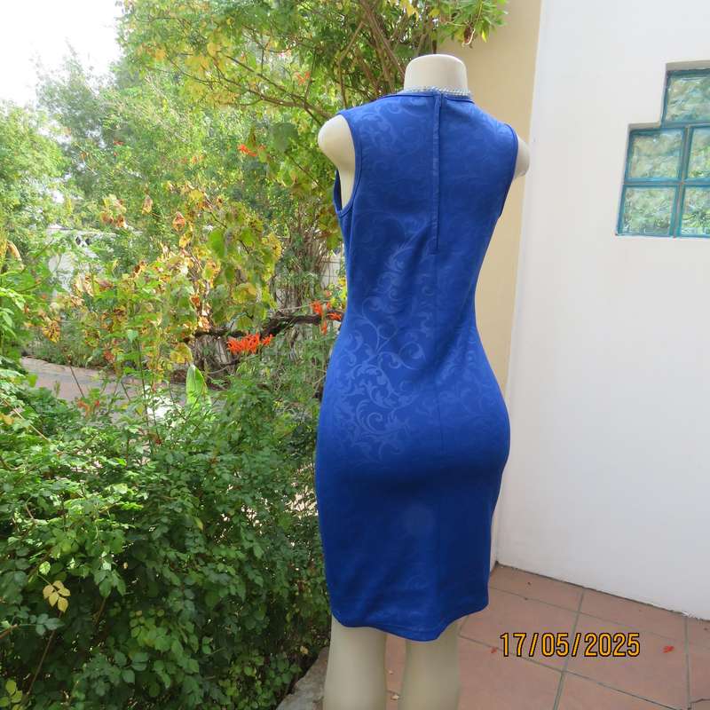 Royal blue bodycon stretch heavy embossed polyester dress. Size 32. Zip at back.
