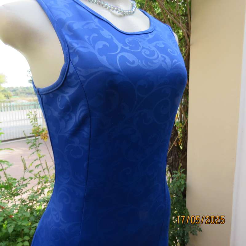 Royal blue bodycon stretch heavy embossed polyester dress. Size 32. Zip at back.