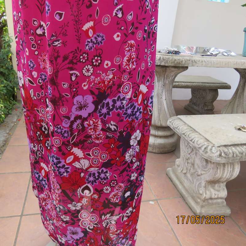 A WOMAN long punch pink fully lined sheer polyester dress. Size 40-42. Floral border