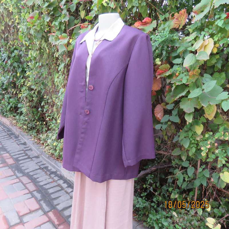 Dark purple boutique made long sleeve elegant partly lined collarless jacket. Size 42-44