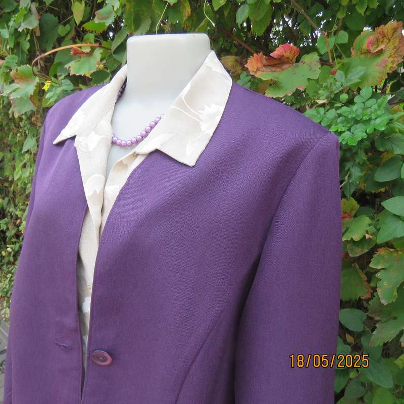 Dark purple boutique made long sleeve elegant partly lined collarless jacket. Size 42-44