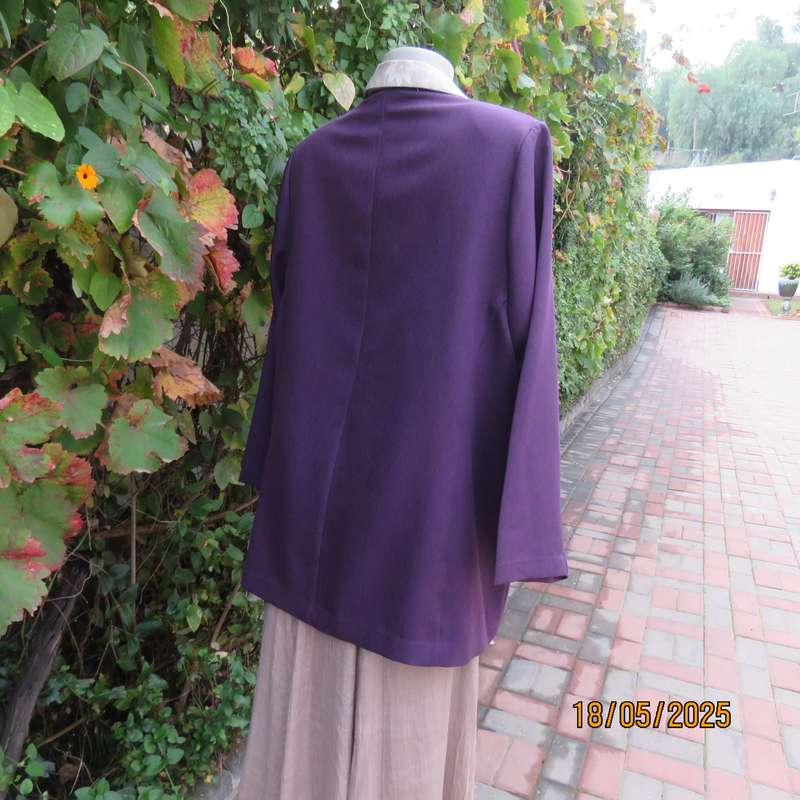 Dark purple boutique made long sleeve elegant partly lined collarless jacket. Size 42-44