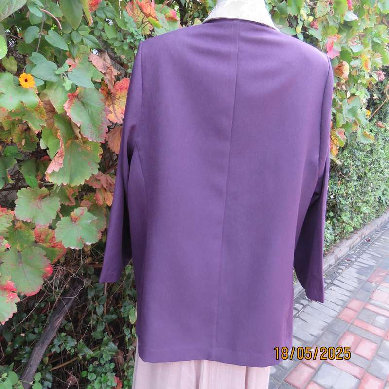Dark purple boutique made long sleeve elegant partly lined collarless jacket. Size 42-44