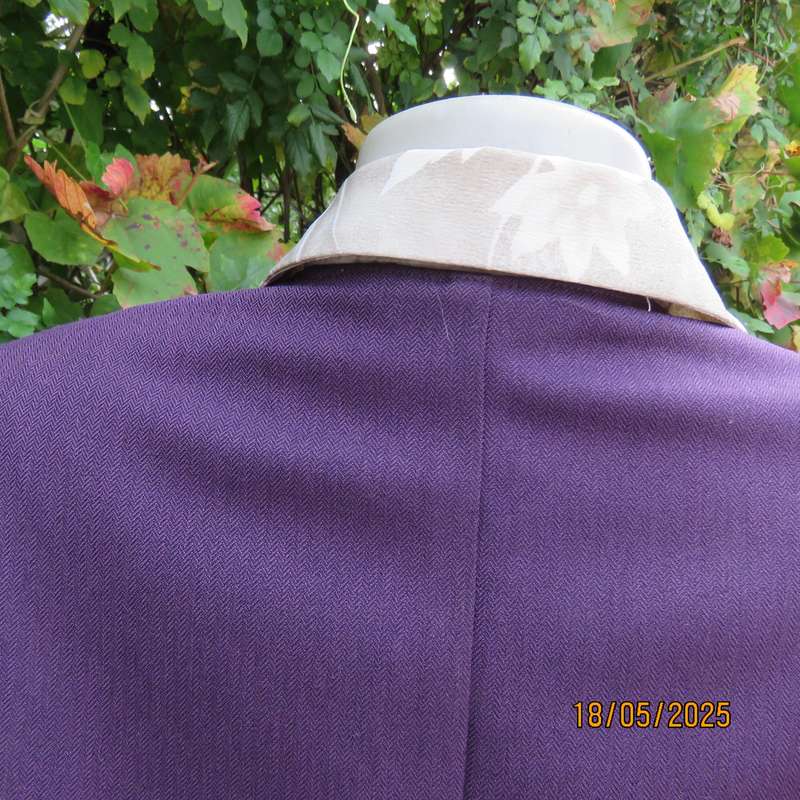 Dark purple boutique made long sleeve elegant partly lined collarless jacket. Size 42-44