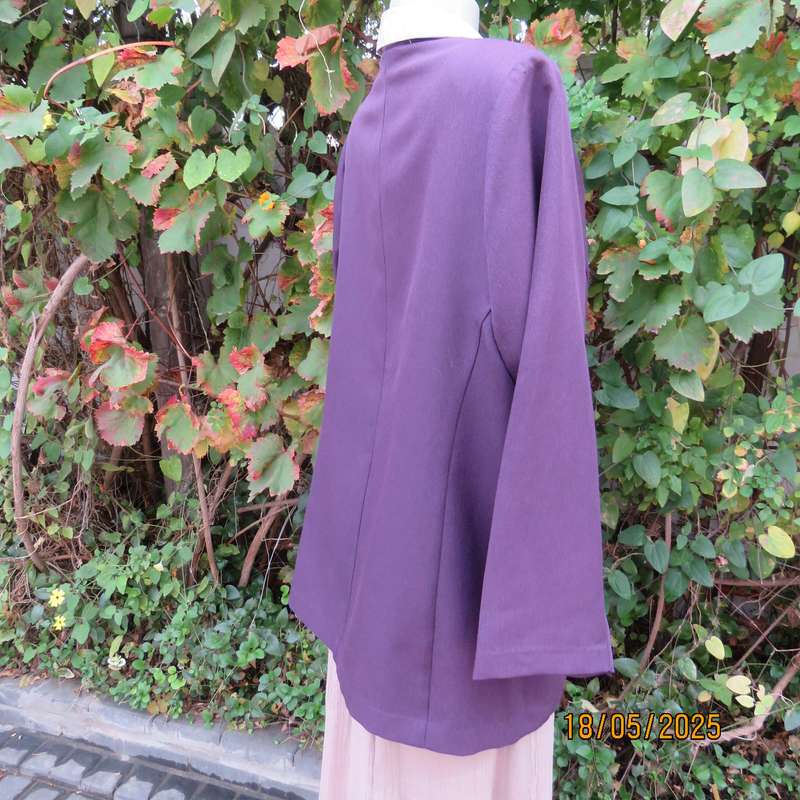 Dark purple boutique made long sleeve elegant partly lined collarless jacket. Size 42-44