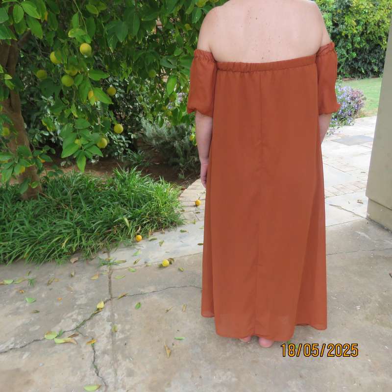 NEW FEELING rust colour loose hanging lined sheer polyester strapless dress. Size 34