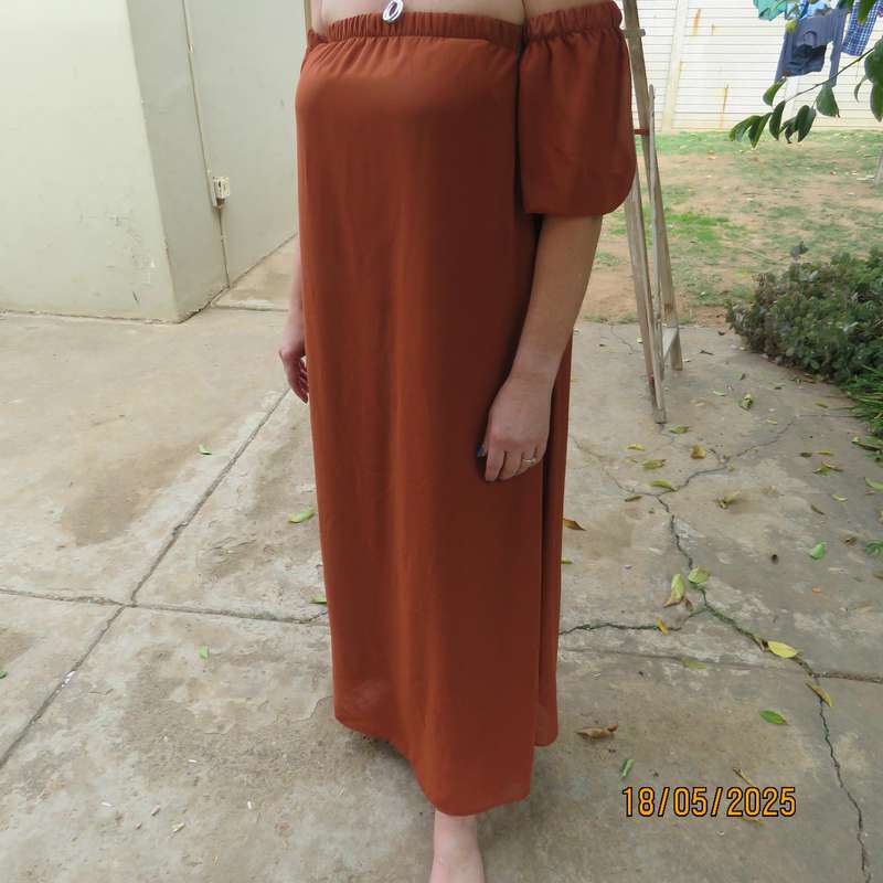 NEW FEELING rust colour loose hanging lined sheer polyester strapless dress. Size 34