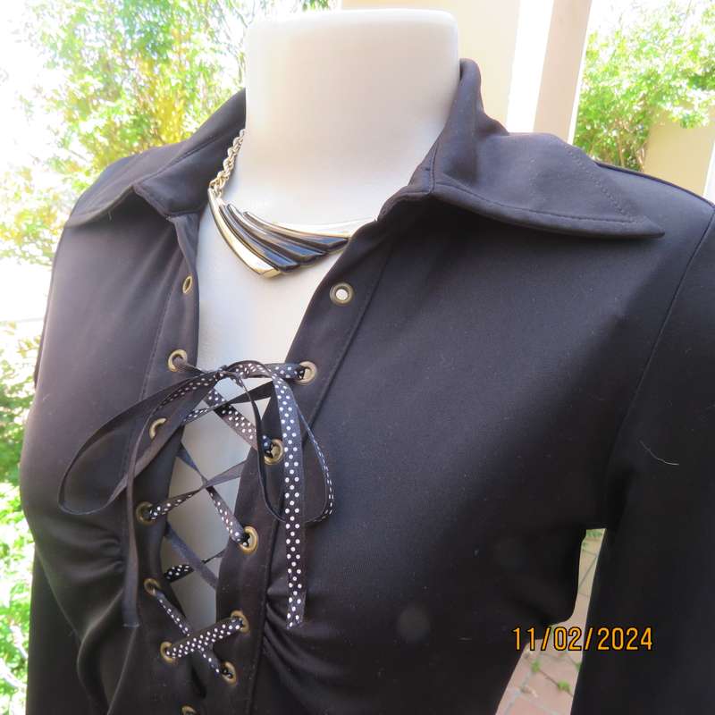 TRUWORTHS black long sleeve stretch polyester size 32 top. With braiding on the front.As new