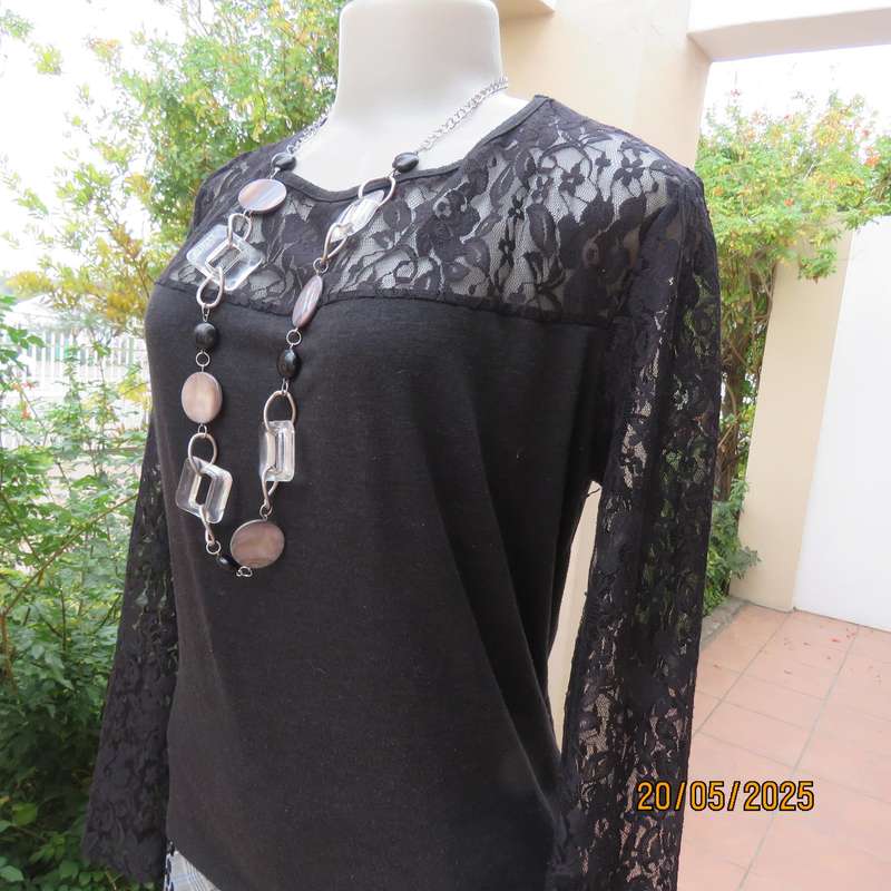 Matte black slip over top with lace front yoke and long sleeve size 42.