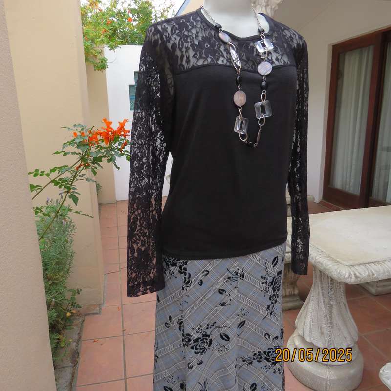 Matte black slip over top with lace front yoke and long sleeve size 42.