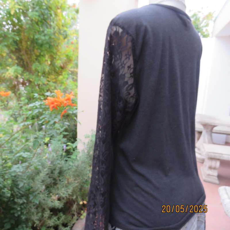 Matte black slip over top with lace front yoke and long sleeve size 42.