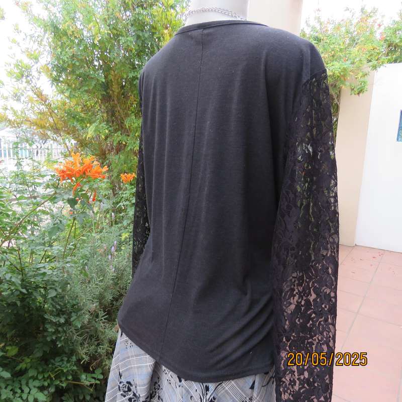 Matte black slip over top with lace front yoke and long sleeve size 42.