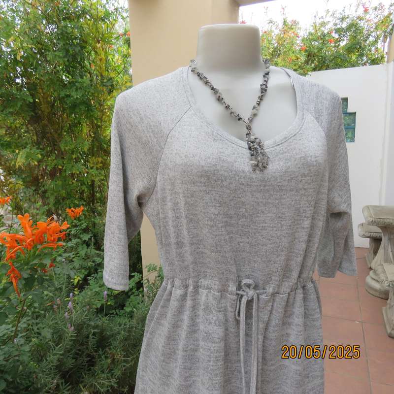 Light grey mottled stretch knitted polyester top size 36. Elbow sleeves.