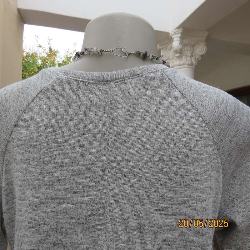 Light grey mottled stretch knitted polyester top size 36. Elbow sleeves.