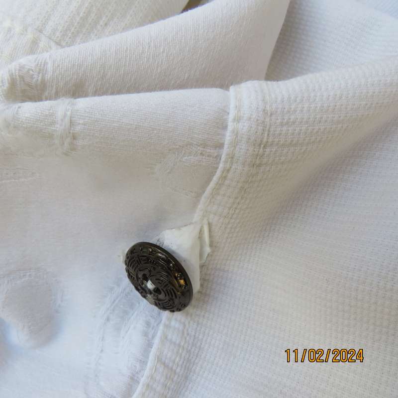 Must have white sleeveless patterned 100% cotton top-jacket. Drawstring hem. Pockets.Detail.Size 38.