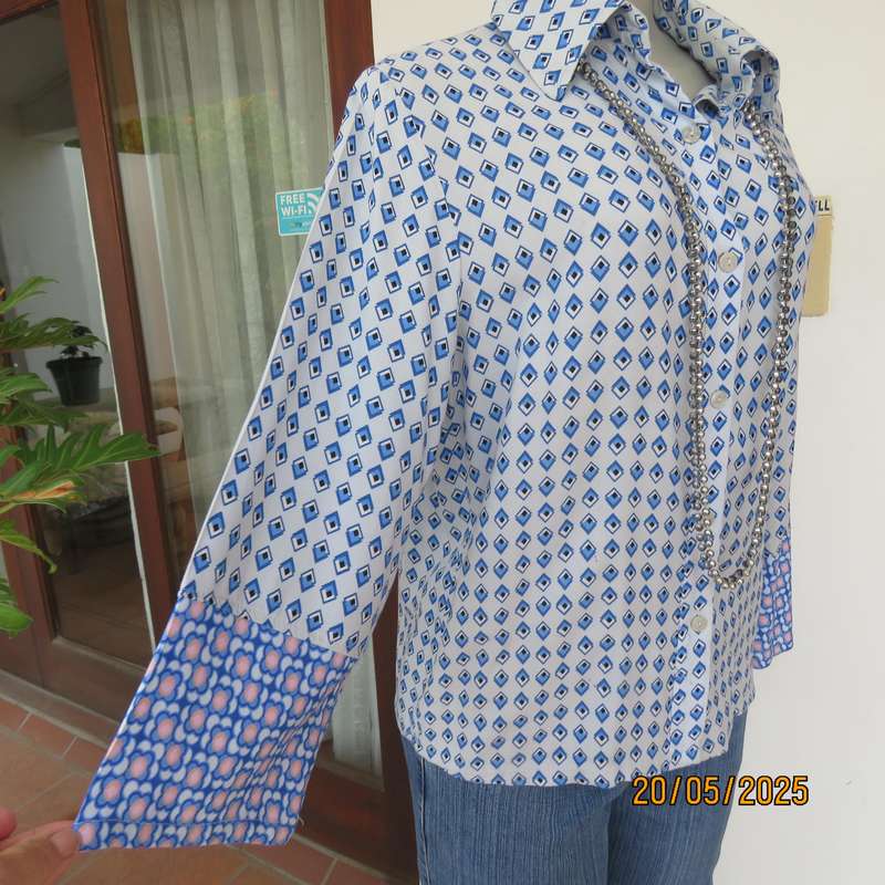 Classic pale blue button down shirt with blue-white diamond patterns. 100% viscose Size 32