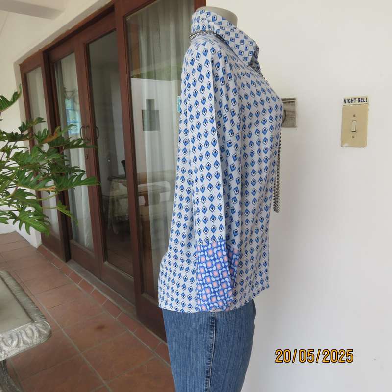 Classic pale blue button down shirt with blue-white diamond patterns. 100% viscose Size 32