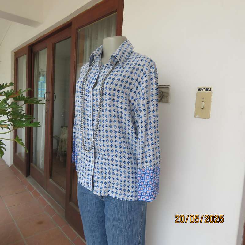 Classic pale blue button down shirt with blue-white diamond patterns. 100% viscose Size 32