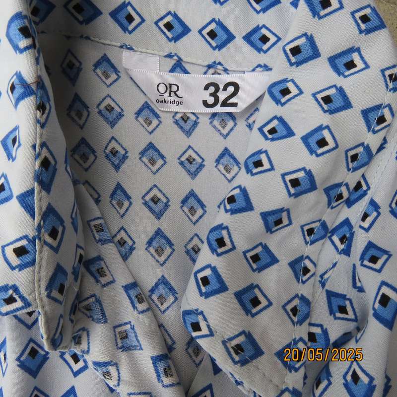 Classic pale blue button down shirt with blue-white diamond patterns. 100% viscose Size 32