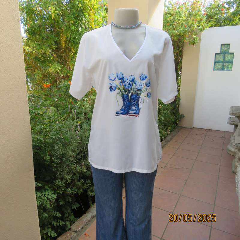 Unique boutique made white V neck short sleeve top. Blue print on front. Size 40