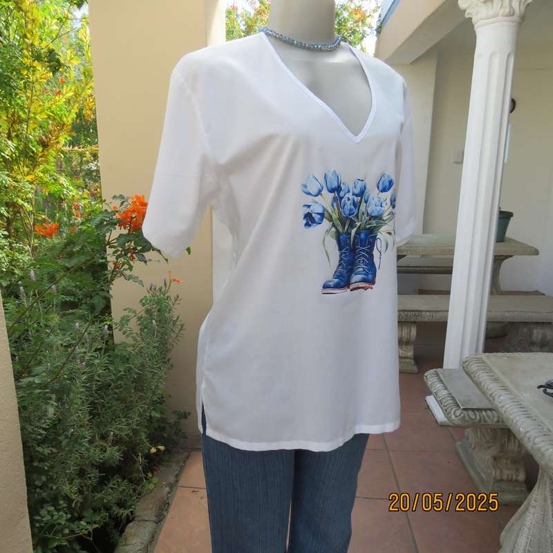 Unique boutique made white V neck short sleeve top. Blue print on front. Size 40