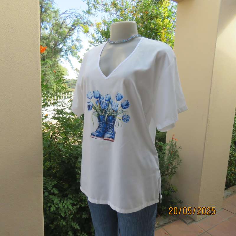 Unique boutique made white V neck short sleeve top. Blue print on front. Size 40