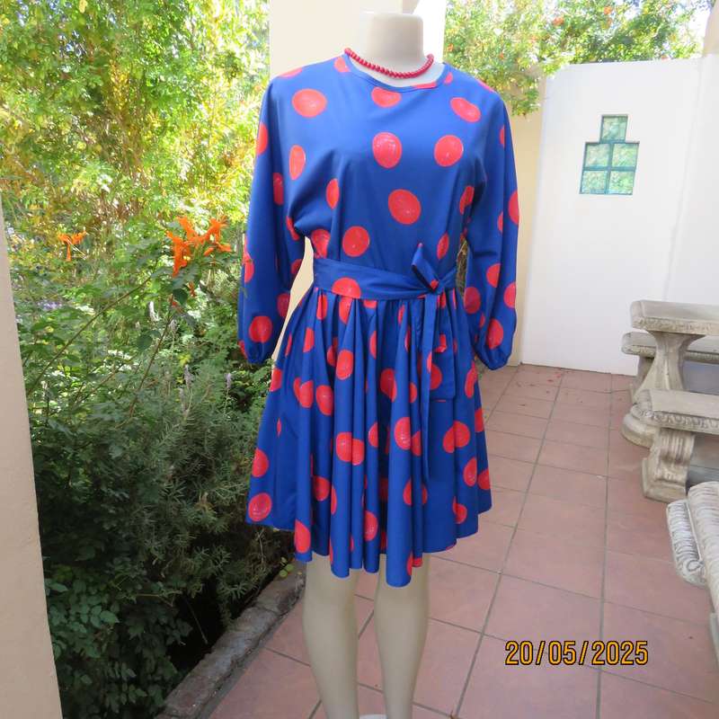 Silky poly-rayon royal blue with crimson circles knee length flare dress. Size 36.