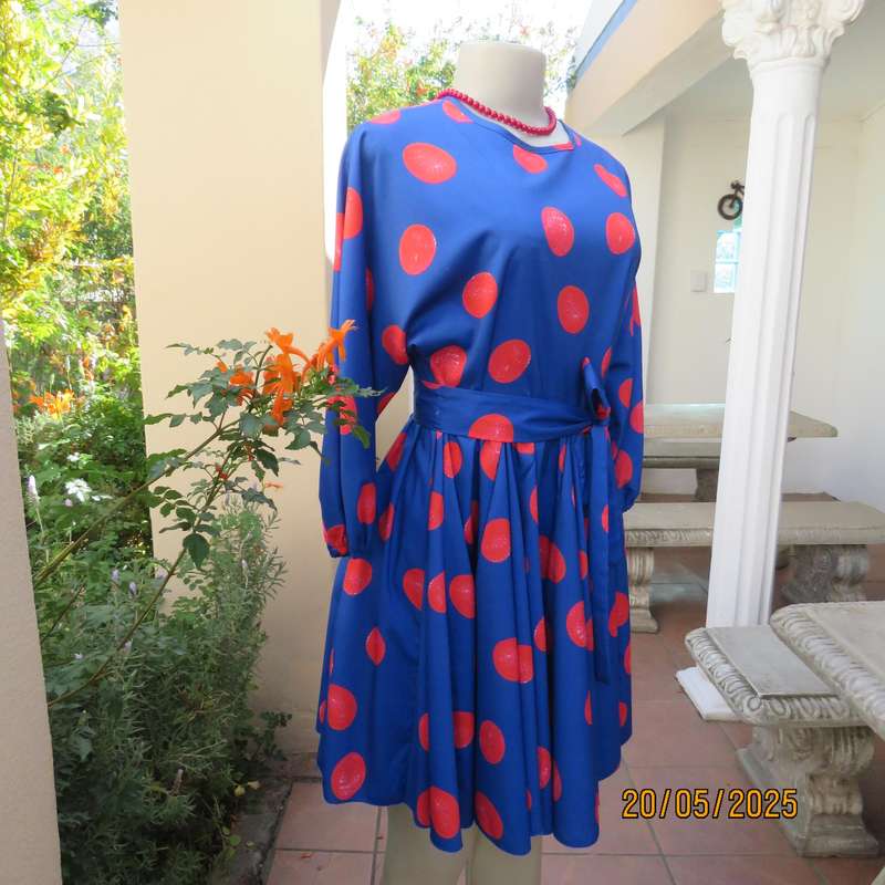 Silky poly-rayon royal blue with crimson circles knee length flare dress. Size 36.