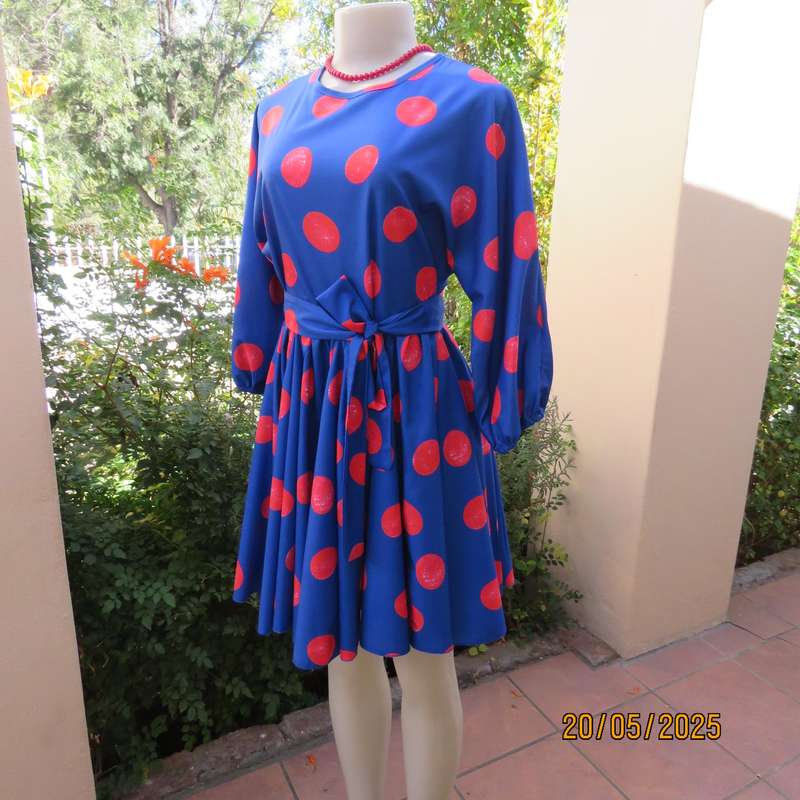 Silky poly-rayon royal blue with crimson circles knee length flare dress. Size 36.