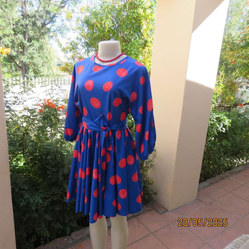 Silky poly-rayon royal blue with crimson circles knee length flare dress. Size 36.