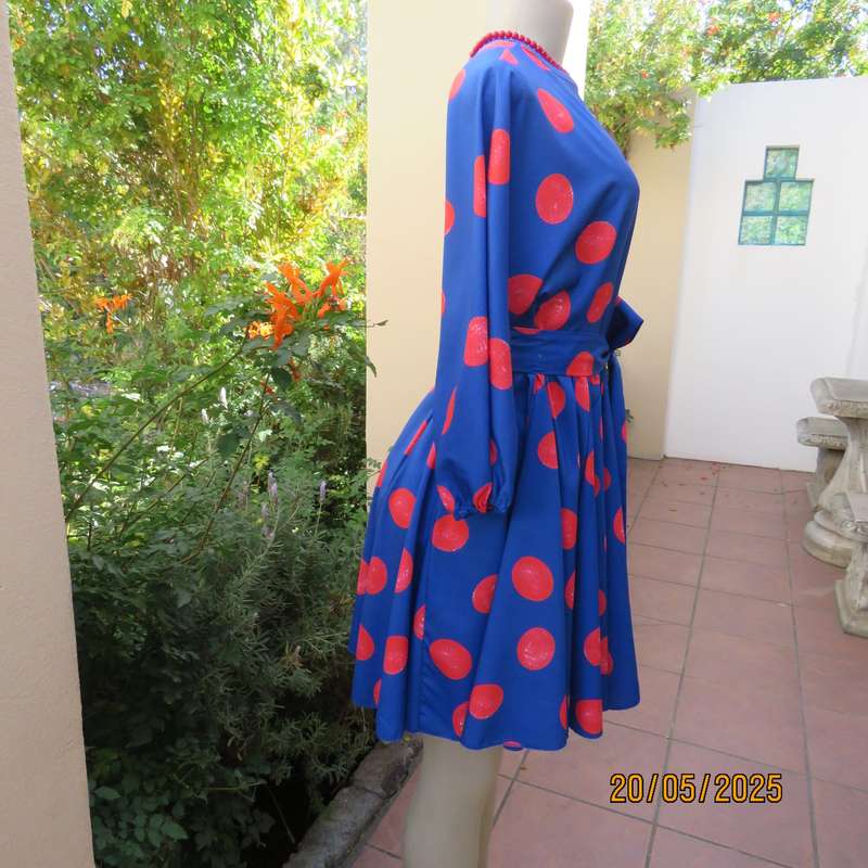 Silky poly-rayon royal blue with crimson circles knee length flare dress. Size 36.