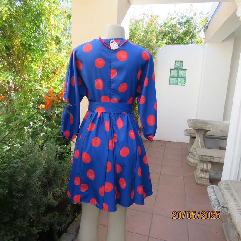 Silky poly-rayon royal blue with crimson circles knee length flare dress. Size 36.