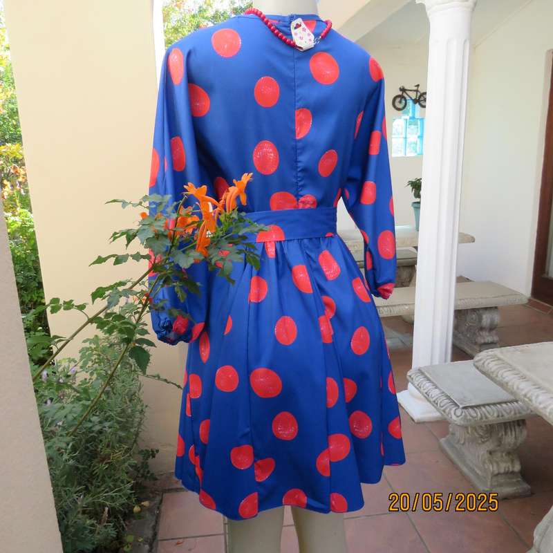 Silky poly-rayon royal blue with crimson circles knee length flare dress. Size 36.