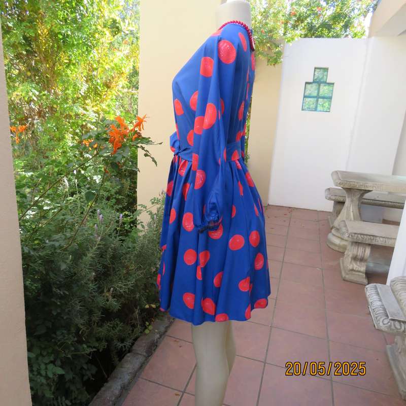 Silky poly-rayon royal blue with crimson circles knee length flare dress. Size 36.