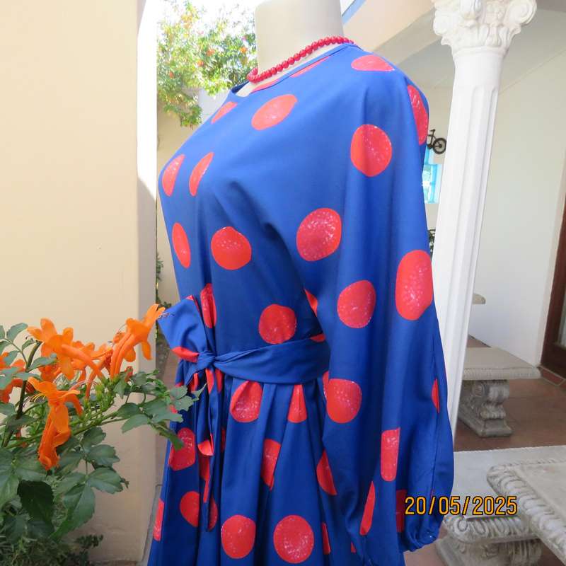 Silky poly-rayon royal blue with crimson circles knee length flare dress. Size 36.