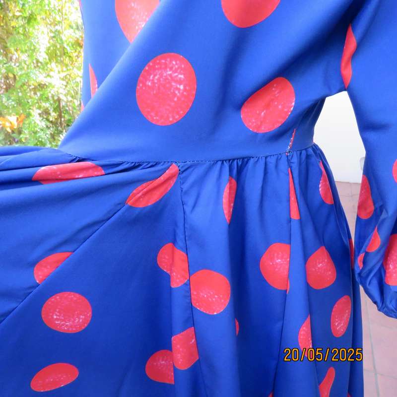 Silky poly-rayon royal blue with crimson circles knee length flare dress. Size 36.