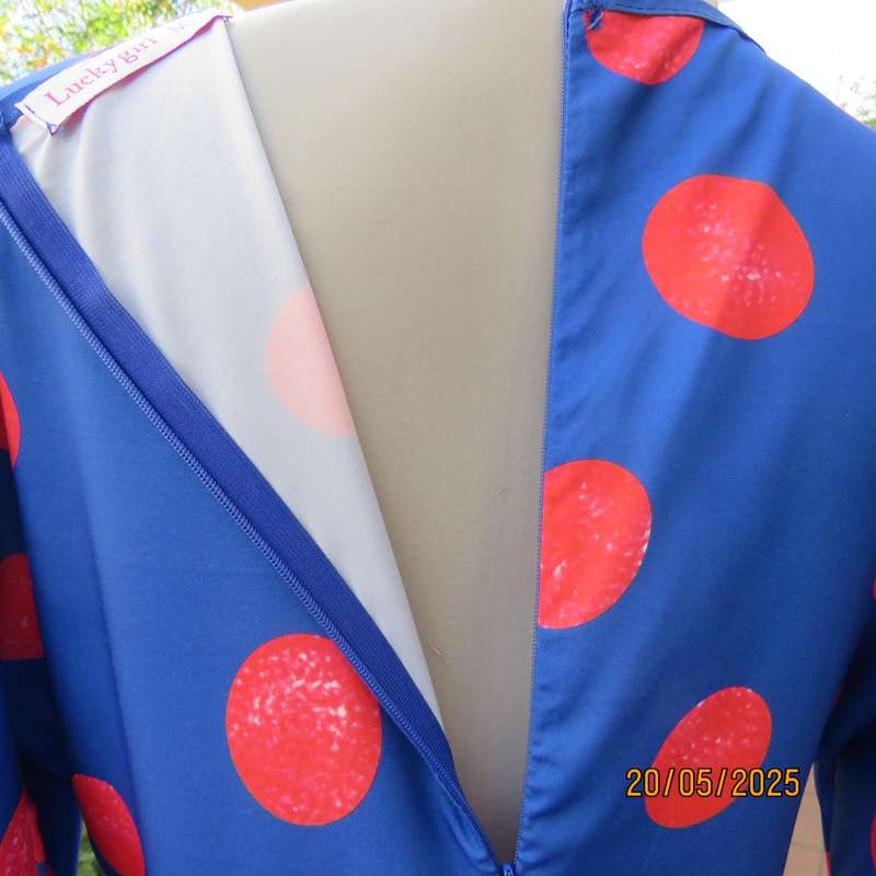 Silky poly-rayon royal blue with crimson circles knee length flare dress. Size 36.